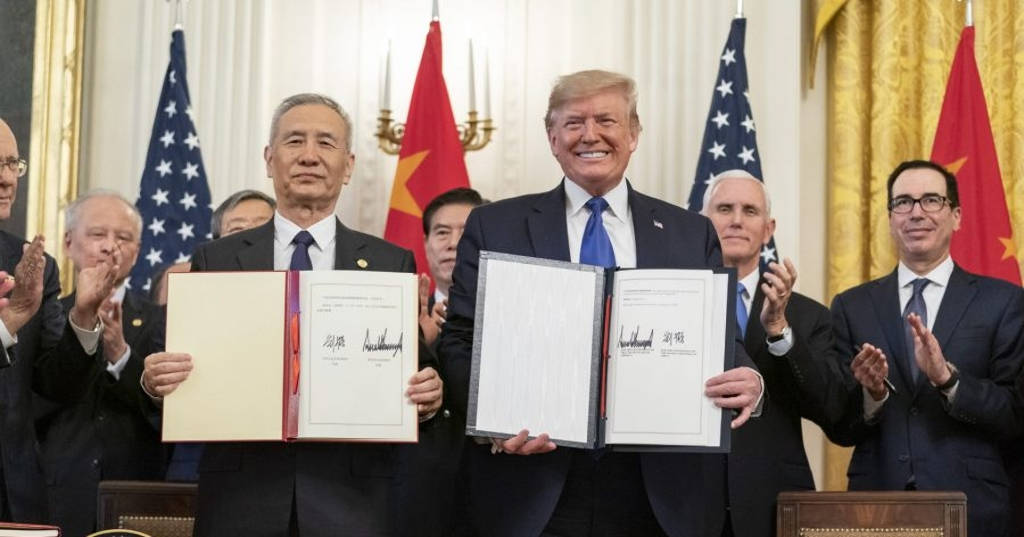 China’s Vice Premier Liu He (left) and U.S. President Donald Trump present the Phase 1 trade agreement