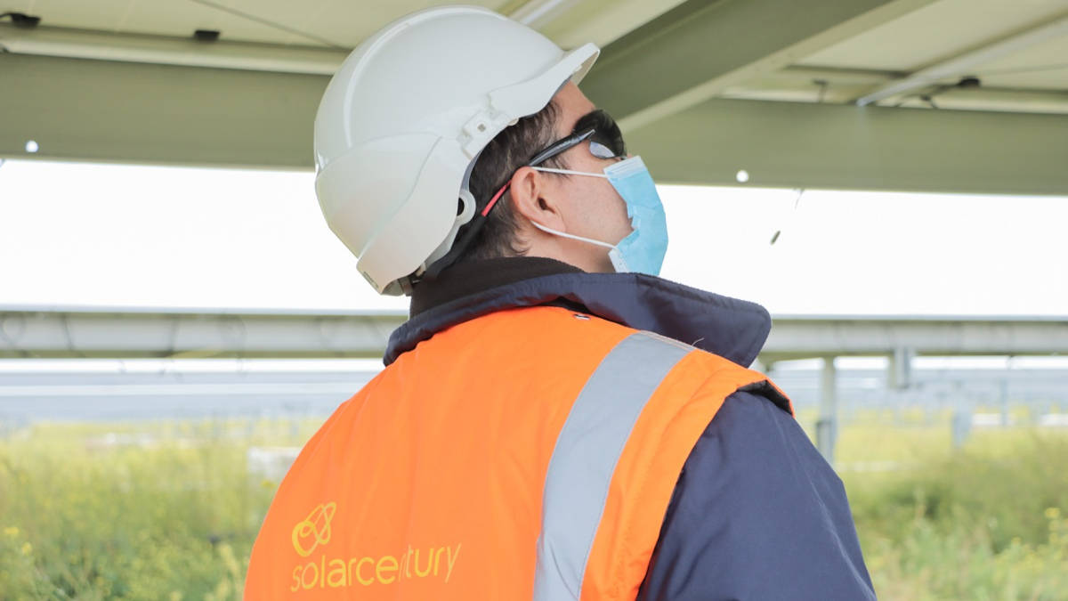 A technician from Solarcentury with face mask inspects Cabrera Solar, a park of four 50 MW solar power plants under construction in Alcalá de Guadaíra near Seville, Andalusia, Spain in April 2020